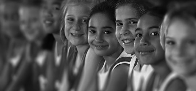 Black and White Image of Young Athletes Smiling